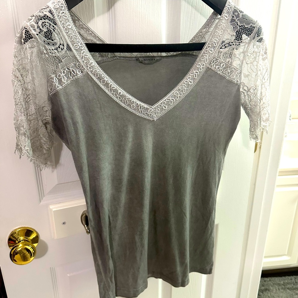 Excellent condition.  Only worn one.  V-neck laced sleeve shirt.  So soft.
